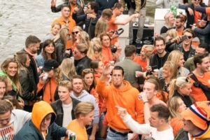 People partying on a boat during kingsday in Amsterdam