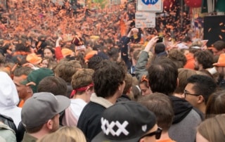 People partying on the street during Kingsday in Amsterdam